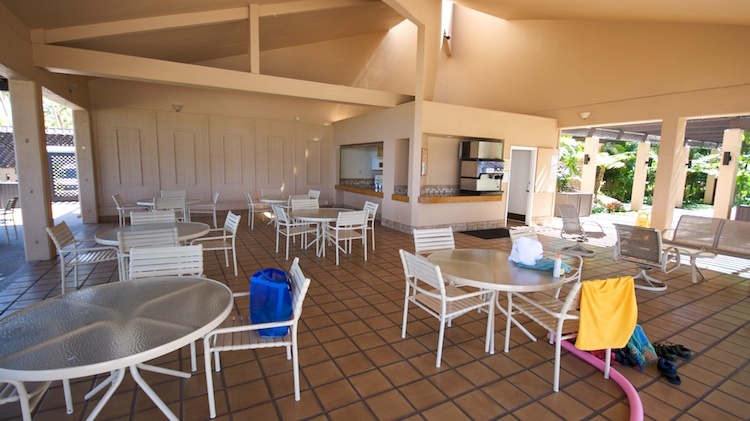 Beachfront pool pavilion with a kitchen and several barbecues